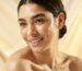 A woman's face with smooth shiny healthy skin